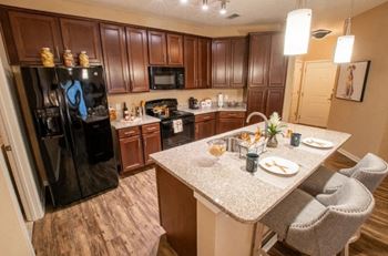 modern kitchen with island at Park Place Apartments